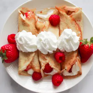 Healthy Breakfast - Sweet Pancakes with Strawberries and Yogurt