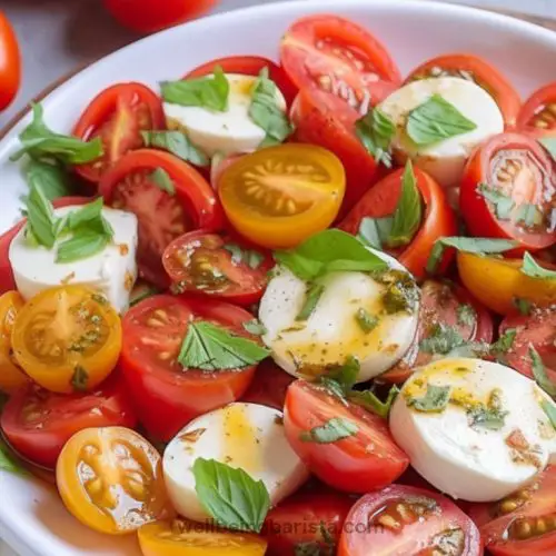 tomato mozzarella salad with olive oil, basil, oregano dressing.