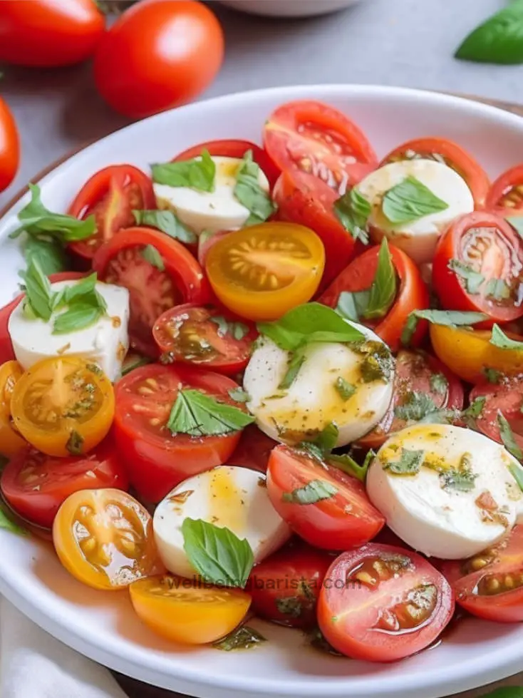 tomato mozzarella salad with olive oil, basil, oregano dressing.