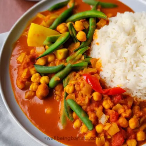 chickpea jalfrezi with red capsicum, green beans and a side of white rice.