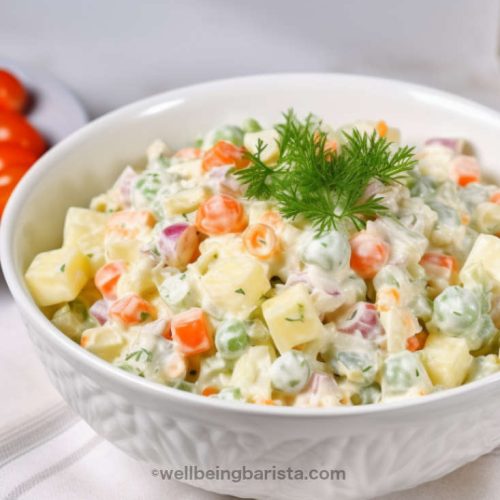 Russian salad with diced potatoes, carrots, pickles, peas and mayo