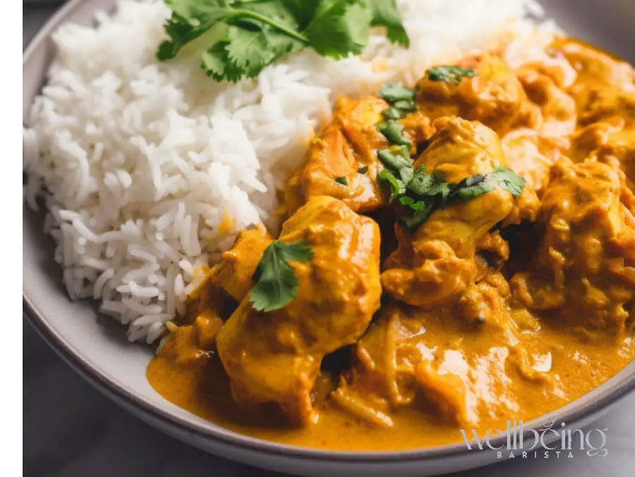 A light Chicken Yoghurt Curry Served With Rice and Cilantro