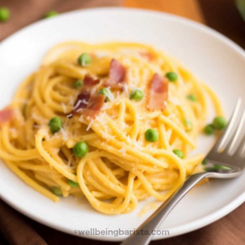 plate with creamy spaghetti carbonara with grated cheese, peas and bacon strips.