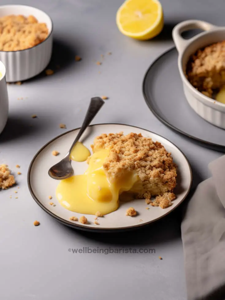 apple crumble served on a plate with lemon curd