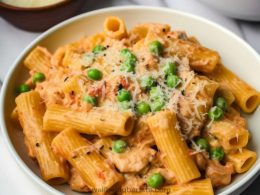 Creamy chicken rigatoni pasta in a combination of marinara and Alfredo sauce with peas, red pepper flakes and parmesan cheese.