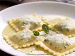 korean inspired white kimchi filled ravioli with a parmesan white sauce topping