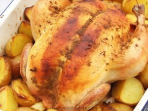 Indulge in the satisfaction of a comforting and budget-friendly meal with this Slow Whole Roasted Chicken with Roast Potatoes recipe. Bursting with spices, onions, and savory drippings, all cooked together in one flavorful pan.