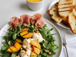 Griddled Peach with Cottage Cheese, Rucola, Prosciutto, Crostini and toasted pine nuts in a lemony olive oil dressing