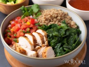 healthy chicken burrito bowl with veggies and quinoa