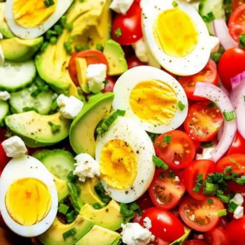 spinach tomato avocado salad with hard boiled egg and cucumbers