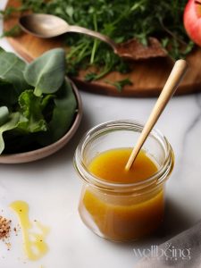Apple cider vinaigrette with garlic in a glass container