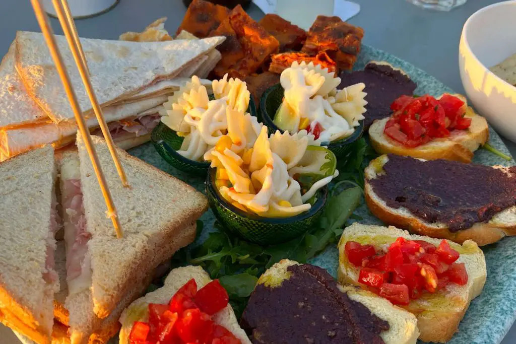 Sicilian aperitivo platter with farfalle pasta and bruschetta
