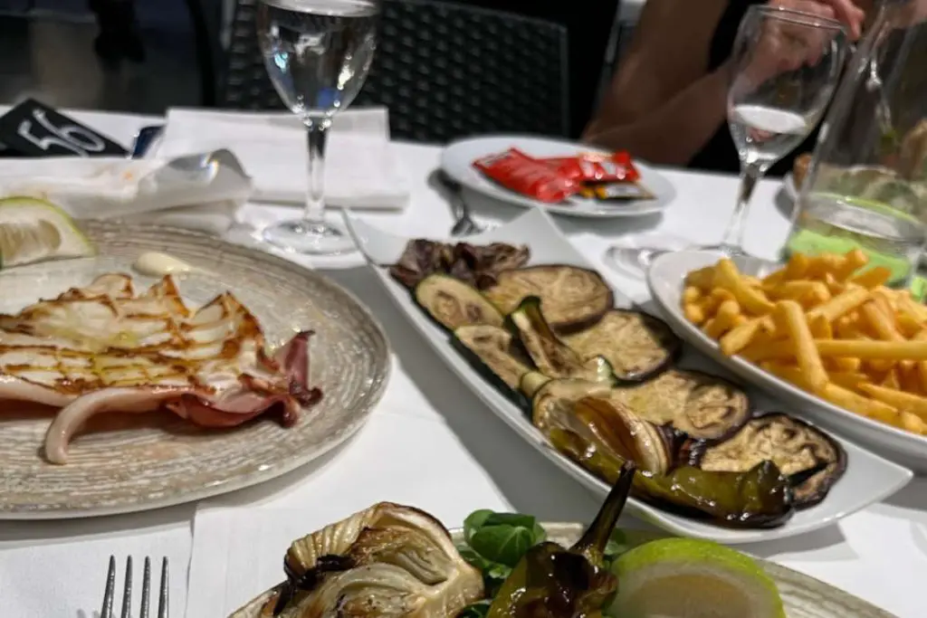Charred aubergines in olive oil, Grilled calamari and summer veggies