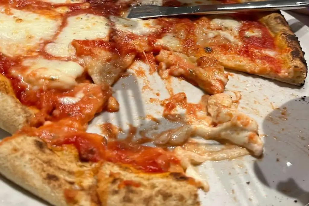 Pizza margherita with tomatoes and mozzarella